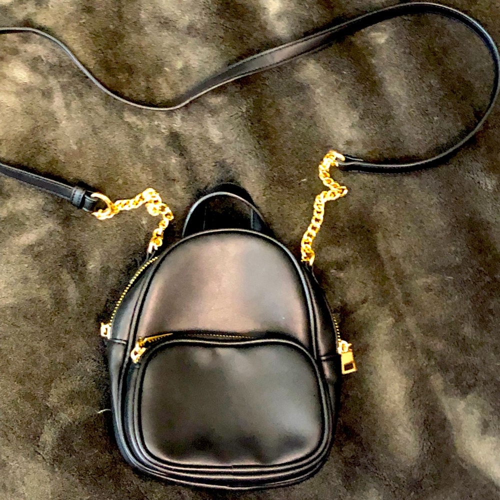 Black crossbody chain mini bag.